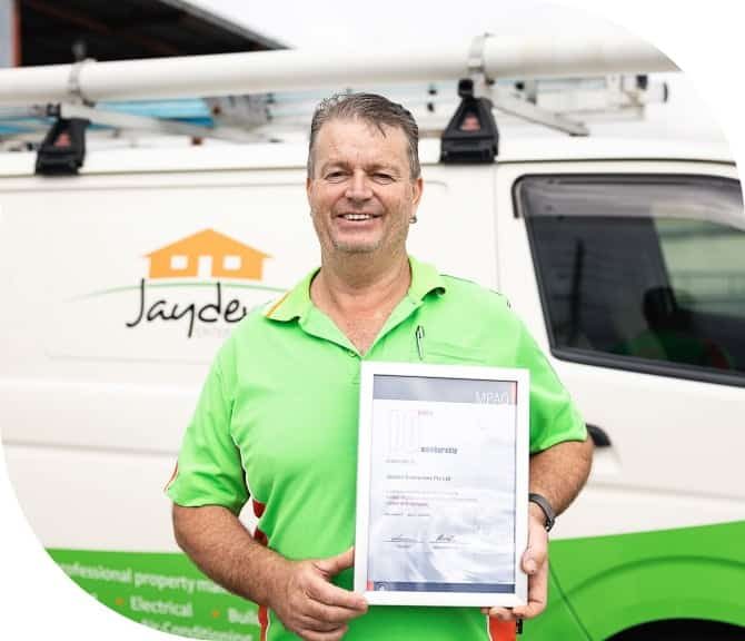 Staff Holding a Certificate — Jayden Enterprises in Mackay, QLD