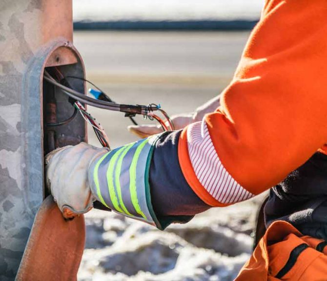 Electrician Fixing An Electricity Pole