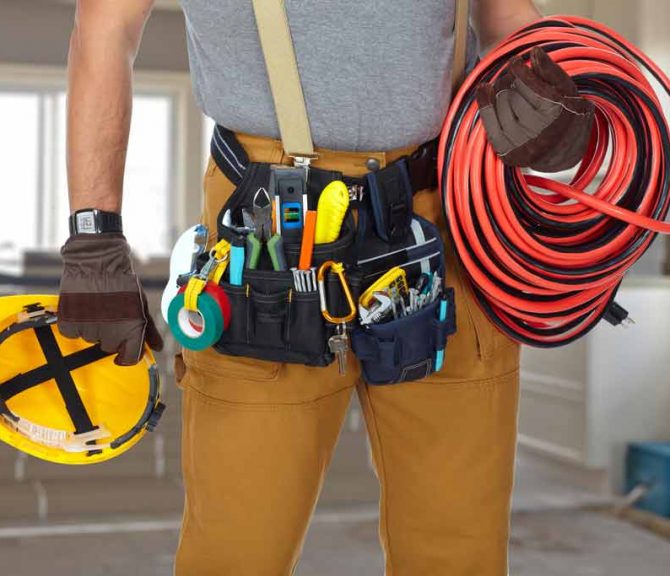 Electrician With Construction Tools And Cable
