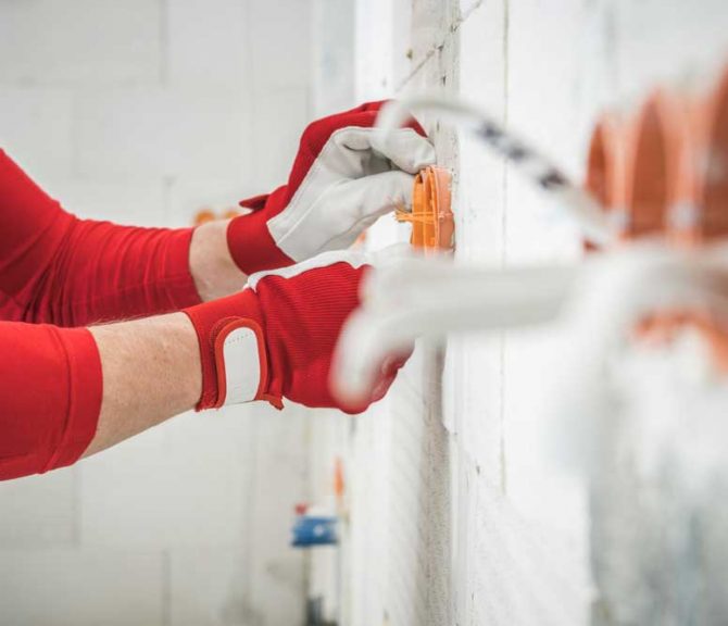 Commercial Electrician Fixing Electrical Wiring